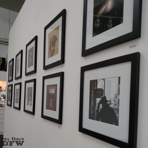 One By One DFW. A gallery wall set up in Atama featuring 100 DFW photographers.